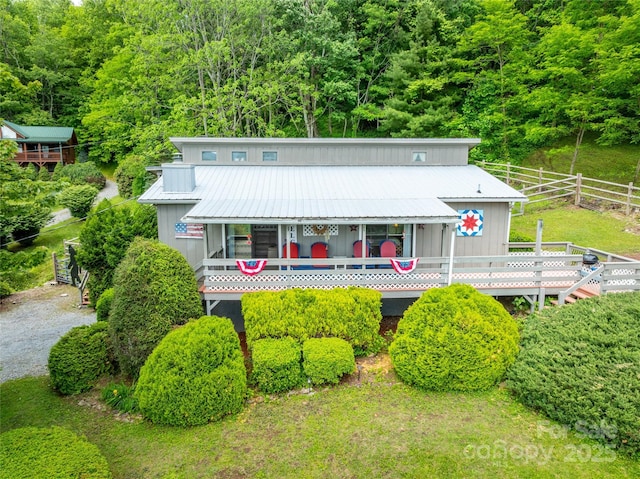 131 Apple Blossom Ln, Maggie Valley, NC 28751 - view of front of home featuring metal roof, board and batten siding, and a forest view