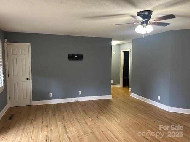 103 Sycamore Rd, Salisbury, NC 28147 - empty room with ceiling fan, wood finished floors, and baseboards