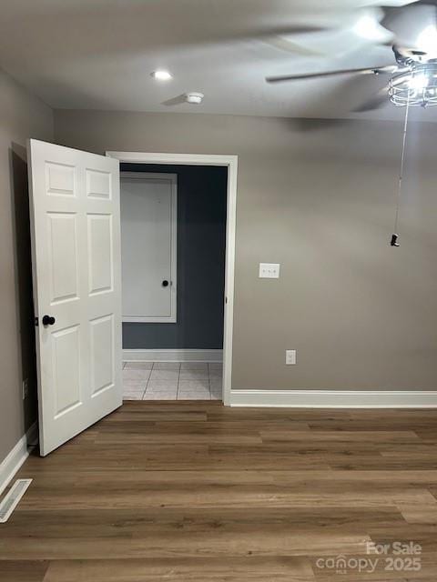 103 Sycamore Rd, Salisbury, NC 28147 - spare room featuring wood finished floors, baseboards, ceiling fan, recessed lighting, and a smoke detector