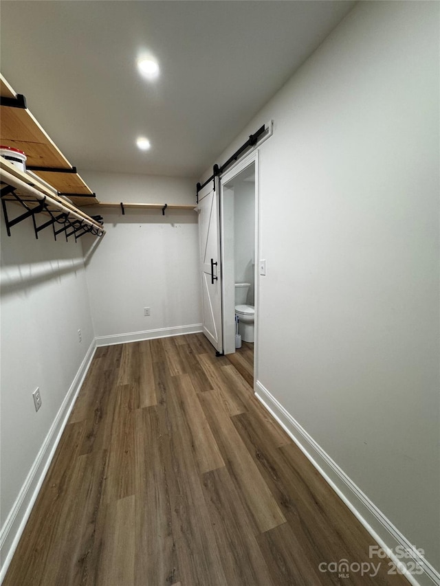 103 Sycamore Rd, Salisbury, NC 28147 - walk in closet with dark wood finished floors and a barn door