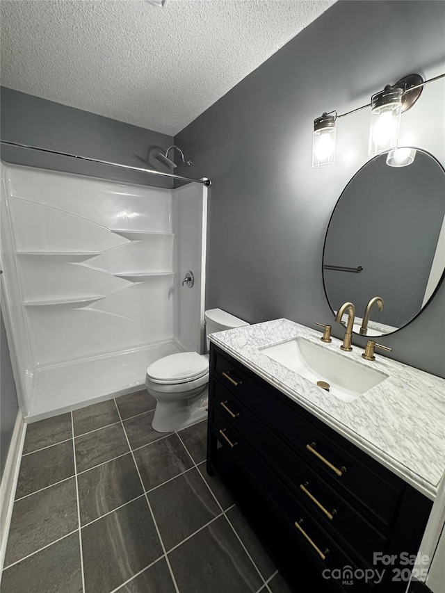 103 Sycamore Rd, Salisbury, NC 28147 - full bathroom featuring vanity, a shower, a textured ceiling, tile patterned floors, and toilet