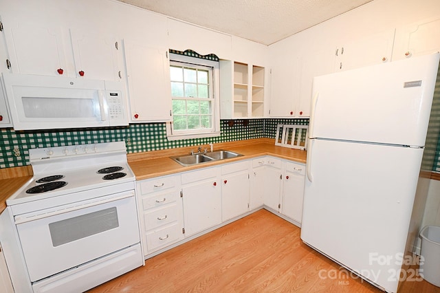 2625 Glenn St, Newton, NC 28658 - kitchen featuring white appliances, light countertops, tasteful backsplash, white cabinets, and a sink