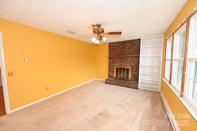 2625 Glenn St, Newton, NC 28658 - unfurnished living room with ceiling fan, a fireplace, light carpet, baseboards, and a baseboard radiator