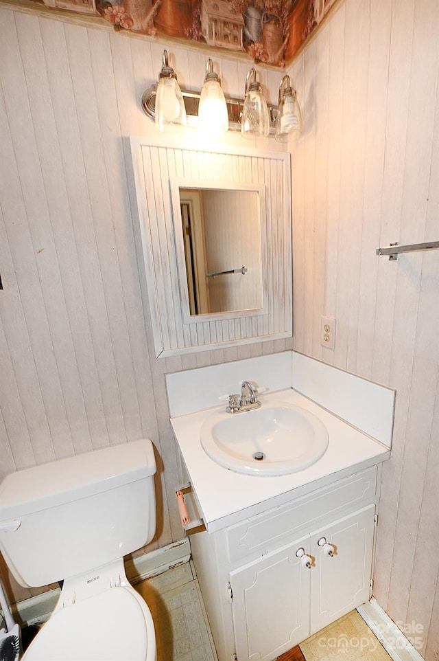 2625 Glenn St, Newton, NC 28658 - half bathroom featuring wooden walls, vanity, and toilet