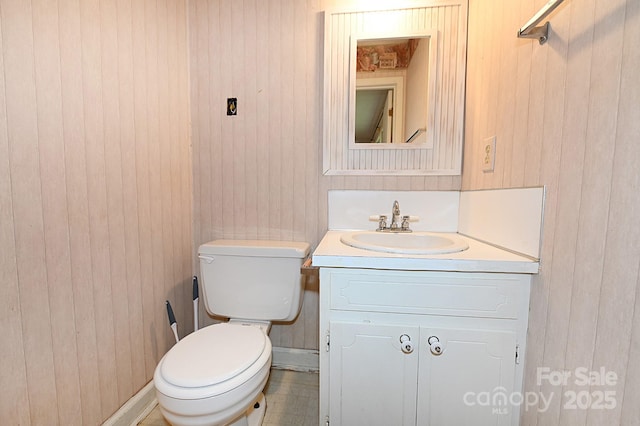 2625 Glenn St, Newton, NC 28658 - half bathroom featuring vanity, toilet, and wood walls