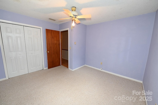 2625 Glenn St, Newton, NC 28658 - unfurnished bedroom with a closet, carpet, baseboards, and a textured ceiling