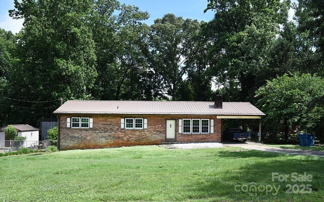 2625 Glenn St, Newton, NC 28658 - ranch-style house featuring brick siding, an attached carport, a chimney, driveway, and metal roof