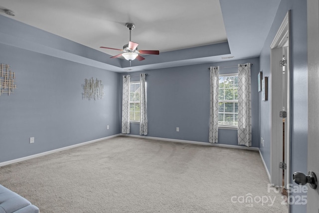 2233 Sonoma Valley Dr, Charlotte, NC 28214 - carpeted empty room featuring a ceiling fan, a raised ceiling, and a smoke detector