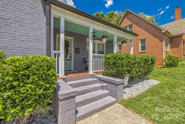 432 4th Street Pl SW, Hickory, NC 28602 - doorway to property with covered porch, brick siding, and a yard