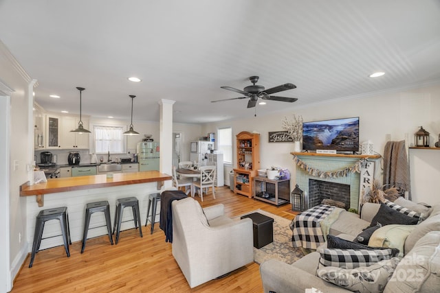 432 4th Street Pl SW, Hickory, NC 28602 - living room with recessed lighting, plenty of natural light, light wood-type flooring, a ceiling fan, and ornamental molding