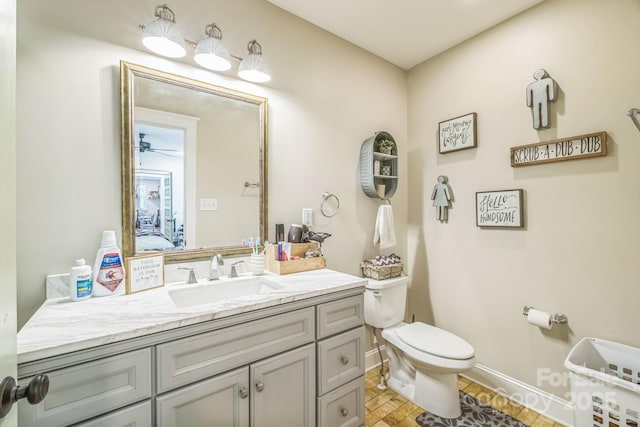 432 4th Street Pl SW, Hickory, NC 28602 - bathroom with toilet, vanity, and baseboards