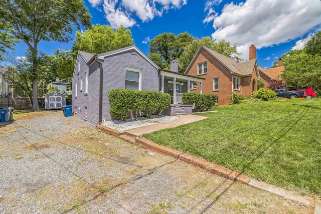 432 4th Street Pl SW, Hickory, NC 28602 - view of front facade with brick siding, a front yard, and a chimney