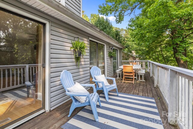 4043 Windward Dr, Tega Cay, SC 29708 - wooden deck featuring outdoor dining space