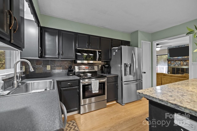4043 Windward Dr, Tega Cay, SC 29708 - kitchen featuring stainless steel appliances, a sink, plenty of natural light, and tasteful backsplash