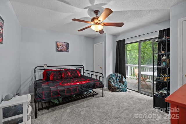 4043 Windward Dr, Tega Cay, SC 29708 - carpeted bedroom featuring access to outside, a textured ceiling, and a ceiling fan