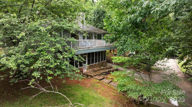 4043 Windward Dr, Tega Cay, SC 29708 - back of property featuring a sunroom, a deck, and a chimney