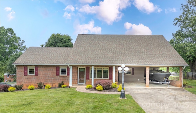 2411 Allendale Cir, Lenoir, NC 28645 - view of front of property featuring brick siding, roof with shingles, a carport, and driveway