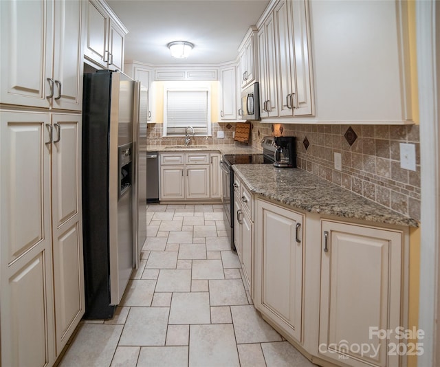 2411 Allendale Cir, Lenoir, NC 28645 - kitchen featuring stainless steel appliances, a sink, backsplash, and light stone countertops