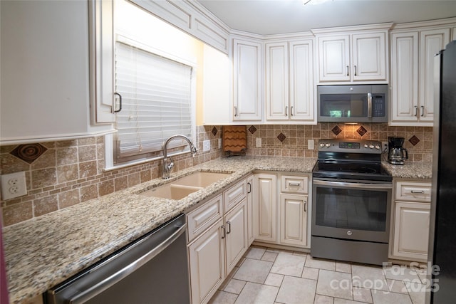 2411 Allendale Cir, Lenoir, NC 28645 - kitchen with stainless steel appliances, a sink, tasteful backsplash, and light stone countertops