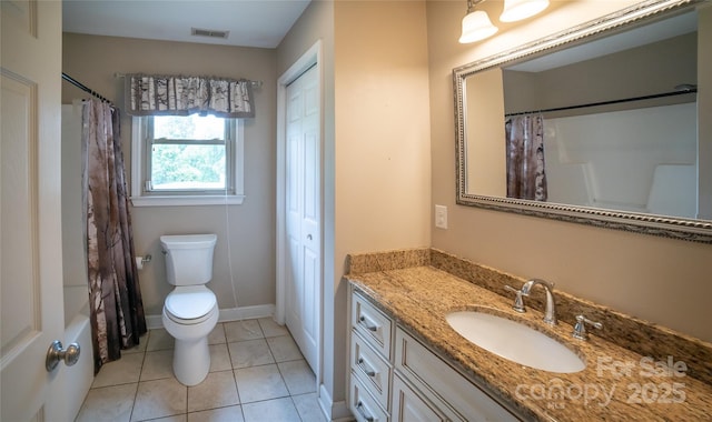 2411 Allendale Cir, Lenoir, NC 28645 - full bath featuring vanity, toilet, tile patterned floors, and baseboards