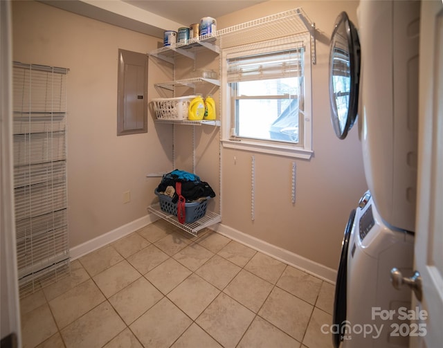 2411 Allendale Cir, Lenoir, NC 28645 - laundry area with electric panel, stacked washing machine and dryer, light tile patterned floors, and baseboards