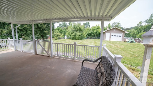 2411 Allendale Cir, Lenoir, NC 28645 - view of patio featuring an outbuilding, a detached garage, and view of wooded area