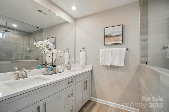 9930 Cask Way, Huntersville, NC 28078 - bathroom featuring double vanity, tiled shower, and recessed lighting