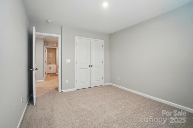 9930 Cask Way, Huntersville, NC 28078 - unfurnished bedroom featuring carpet floors and a closet