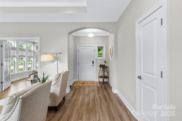 1712 Askern Ct, Waxhaw, NC 28173 - foyer entrance with arched walkways, wood finished floors, baseboards, and crown molding