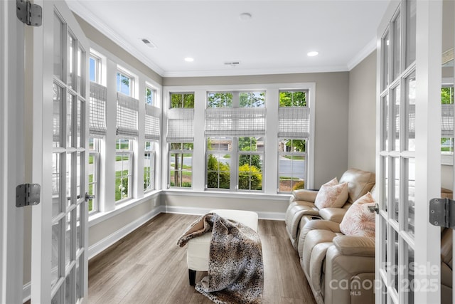 1712 Askern Ct, Waxhaw, NC 28173 - sunroom featuring plenty of natural light, crown molding, wood finished floors, baseboards, and recessed lighting