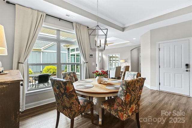 1712 Askern Ct, Waxhaw, NC 28173 - dining space with a chandelier, wood finished floors, ornamental molding, arched walkways, and healthy amount of natural light