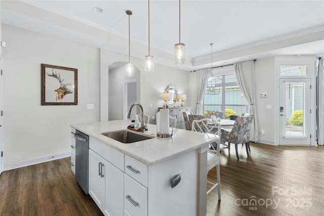 1712 Askern Ct, Waxhaw, NC 28173 - kitchen with a sink, stainless steel dishwasher, arched walkways, dark wood-style flooring, and an island with sink