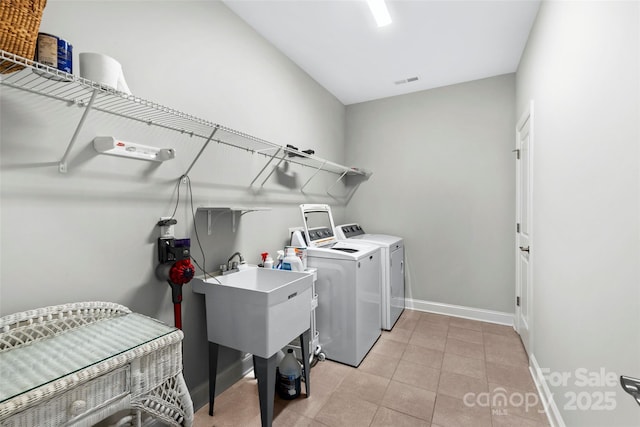 1712 Askern Ct, Waxhaw, NC 28173 - washroom featuring independent washer and dryer, baseboards, and light tile patterned flooring