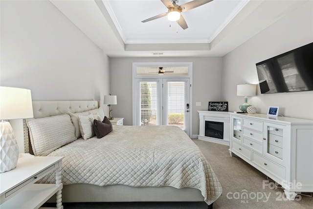 1712 Askern Ct, Waxhaw, NC 28173 - carpeted bedroom featuring a raised ceiling, access to exterior, ornamental molding, and a ceiling fan