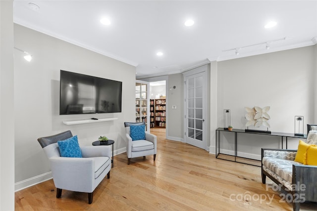 1712 Askern Ct, Waxhaw, NC 28173 - sitting room with crown molding, wood finished floors, baseboards, recessed lighting, and rail lighting