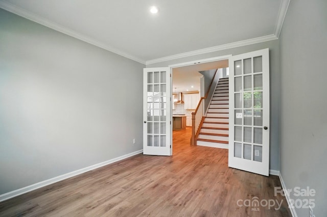9957 Cask Way, Huntersville, NC 28078 - unfurnished room featuring french doors, crown molding, baseboards, stairs, and wood finished floors