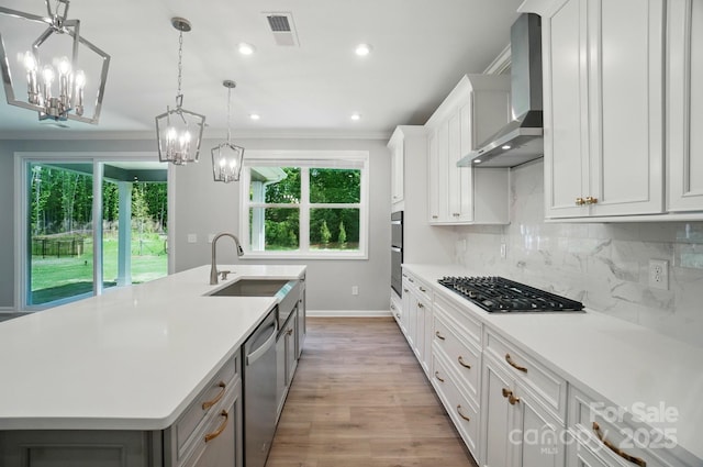 9957 Cask Way, Huntersville, NC 28078 - kitchen featuring wall chimney exhaust hood, a sink, appliances with stainless steel finishes, baseboards, and an island with sink
