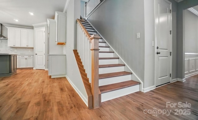 9957 Cask Way, Huntersville, NC 28078 - stairway with wood finished floors, recessed lighting, crown molding, and baseboards