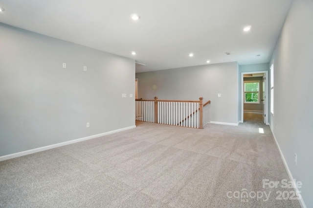 9957 Cask Way, Huntersville, NC 28078 - spare room featuring light carpet, recessed lighting, and baseboards