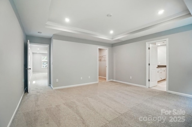 9957 Cask Way, Huntersville, NC 28078 - unfurnished bedroom featuring a raised ceiling, recessed lighting, a spacious closet, light carpet, and baseboards