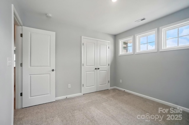 9957 Cask Way, Huntersville, NC 28078 - unfurnished bedroom featuring carpet flooring, baseboards, and a closet