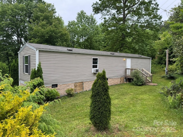 view of home's exterior with a yard and crawl space