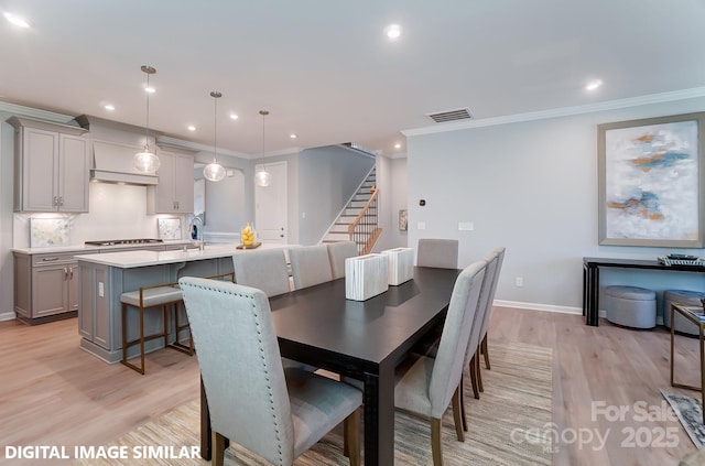 9842 Quercus Ln, Huntersville, NC 28078 - dining area featuring stairway, light wood-type flooring, ornamental molding, recessed lighting, and baseboards
