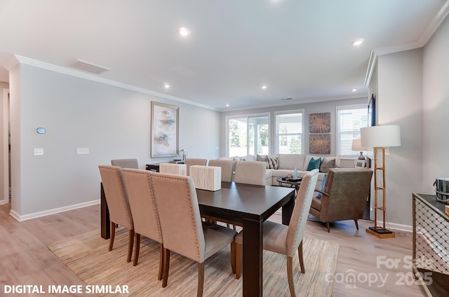 9842 Quercus Ln, Huntersville, NC 28078 - dining area with baseboards, crown molding, light wood finished floors, and recessed lighting