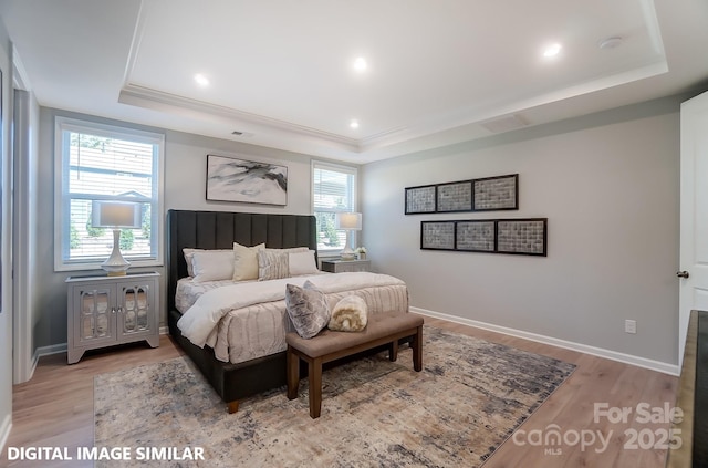 9842 Quercus Ln, Huntersville, NC 28078 - bedroom with a raised ceiling, multiple windows, wood finished floors, and recessed lighting