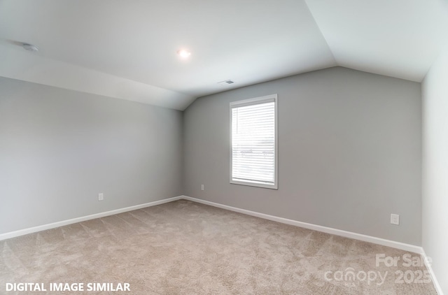 9842 Quercus Ln, Huntersville, NC 28078 - additional living space featuring vaulted ceiling, light colored carpet, and baseboards