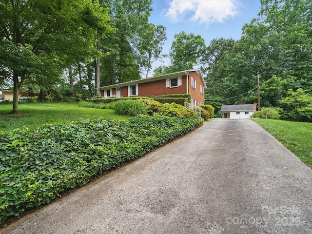 220 Lakeview Dr, Belmont, NC 28012 - view of front of house featuring brick siding, an outbuilding, a front yard, and a detached garage
