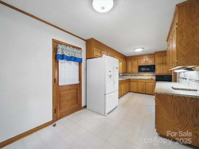 220 Lakeview Dr, Belmont, NC 28012 - kitchen featuring white refrigerator with ice dispenser, black microwave, light flooring, brown cabinetry, and a textured ceiling