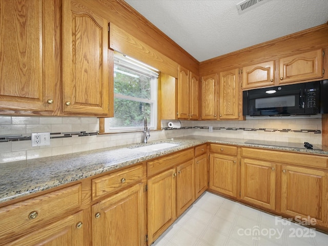 220 Lakeview Dr, Belmont, NC 28012 - kitchen with black appliances, a sink, light stone counters, tasteful backsplash, and brown cabinets