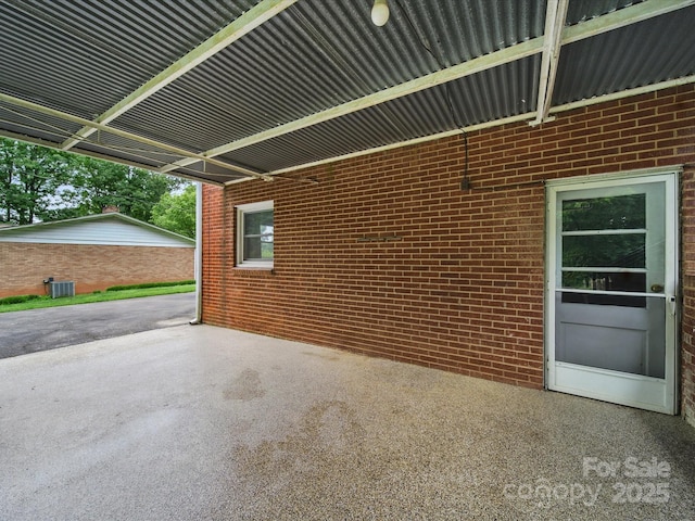 220 Lakeview Dr, Belmont, NC 28012 - view of side of home with brick siding, a patio area, and central AC